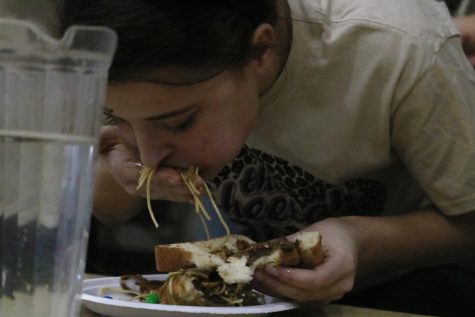 Tanya Maples (Cooper) inhales the “Buddy the Elf” sandwich for Cooper house. The sandwich had syrup, m&ms, chocolate syrup, and crushed oreos.
