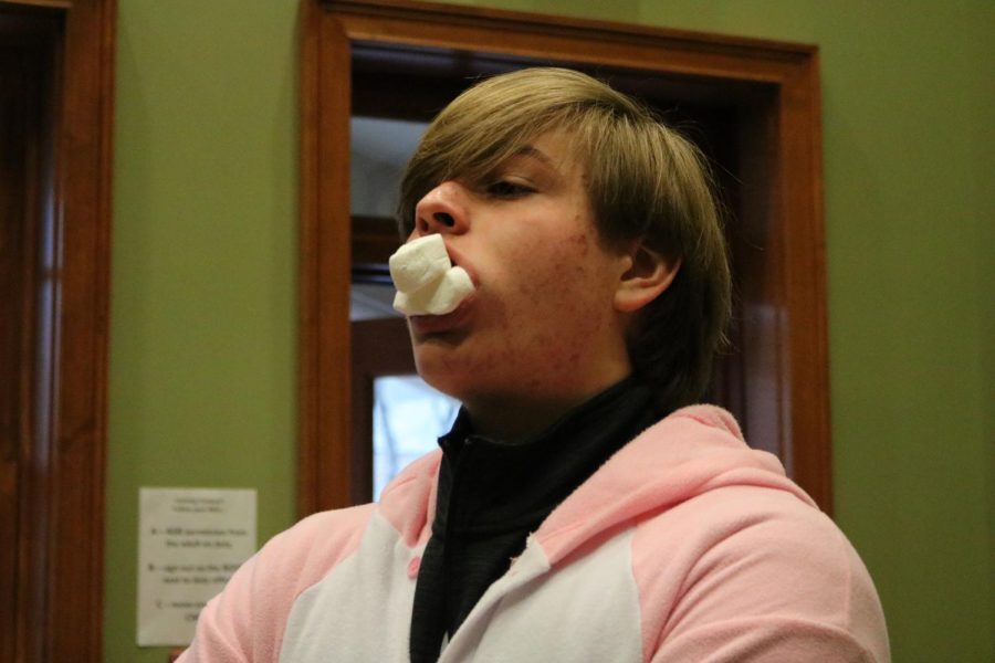 Senior Bryson Collier has a mouth full of marshmallows for the Chubby Bunny Challenge.