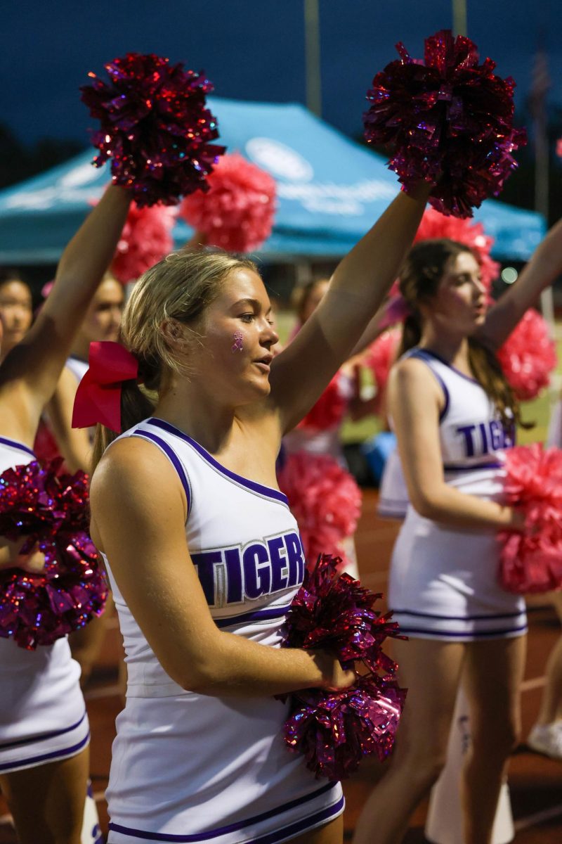 Emi Grace Wood during cheer season before she switches to basketball