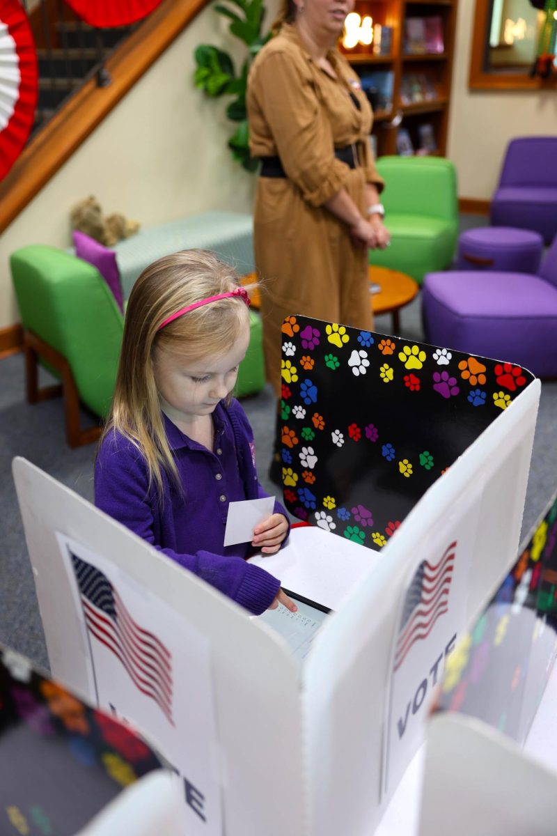 Penny Miller votes during the Lower School Food Election.