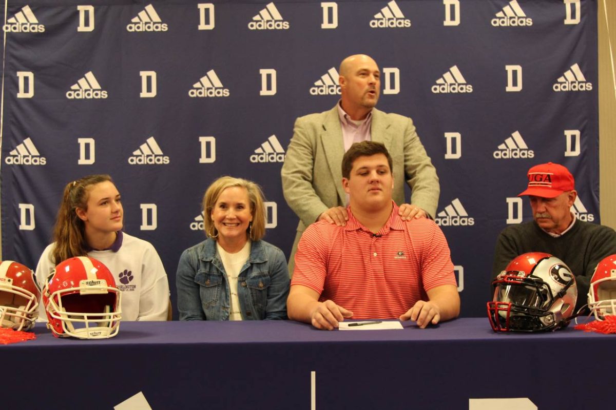 Senior Tate Ratledge signs to play football for the Georgia Bulldogs alongside his family.