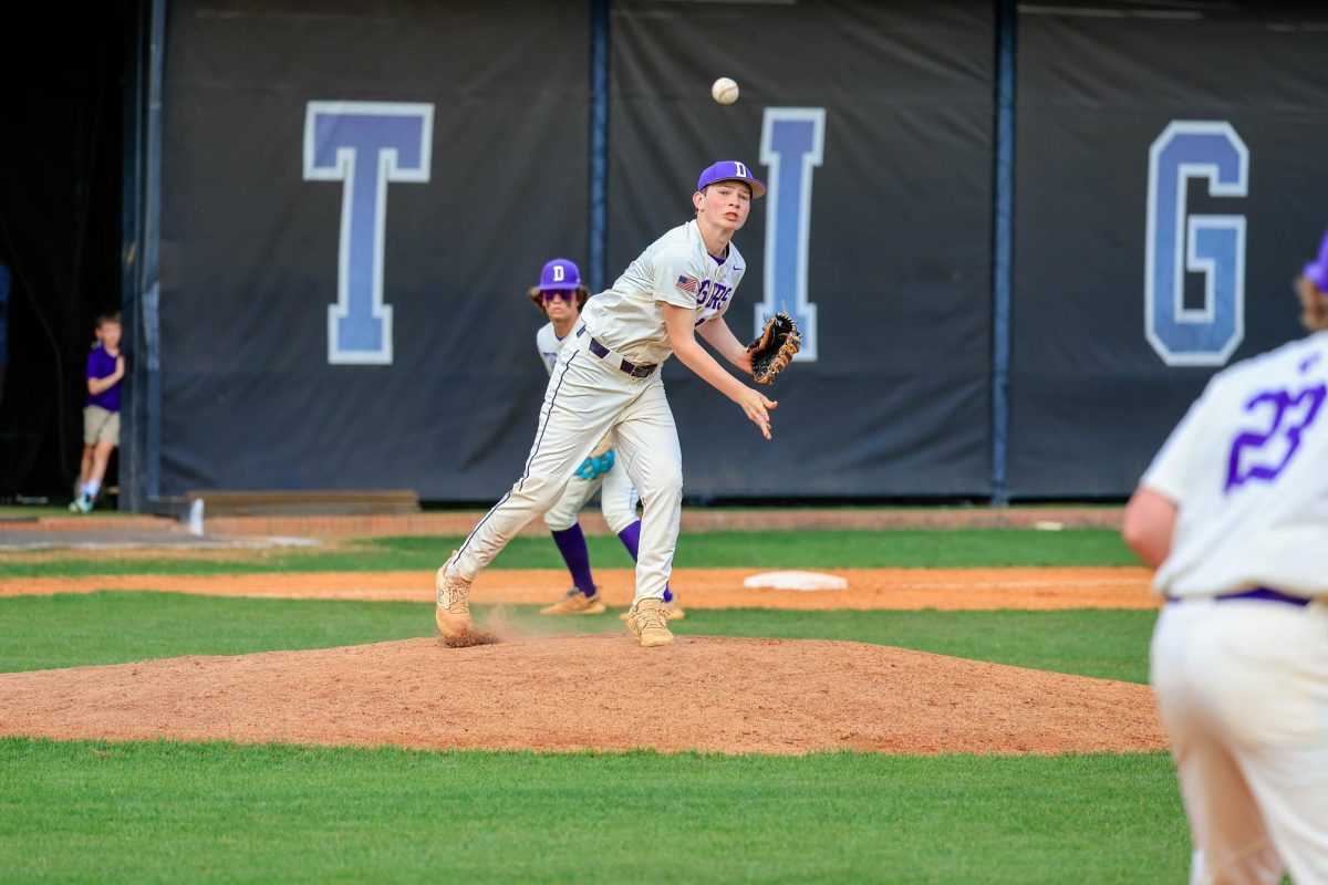 Sophomore Cooper Norris throws a pitch.