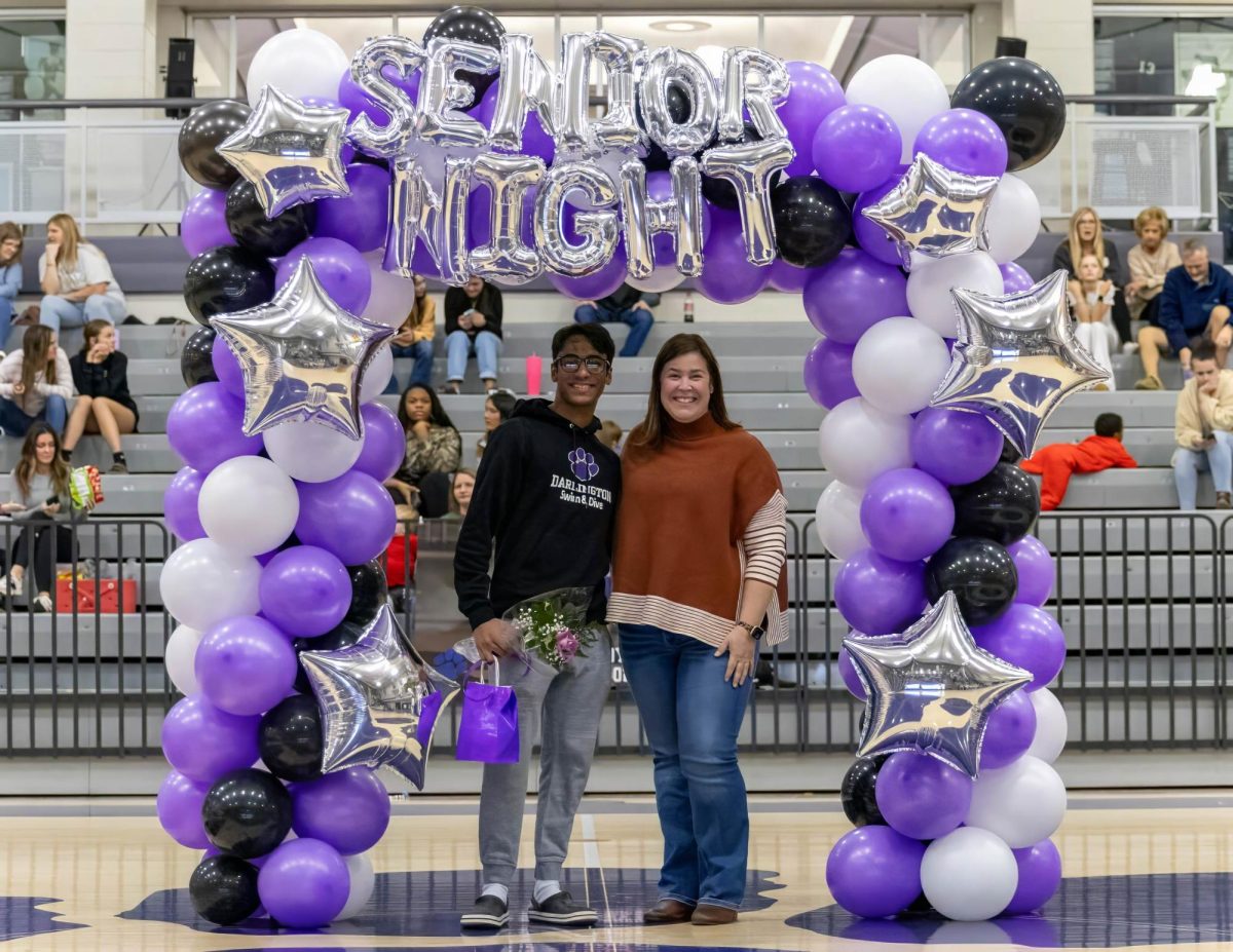 Senior Rayan Maqbool poses with Jaclyn Haynes for Winter Sports Senior Night on Jan. 28.