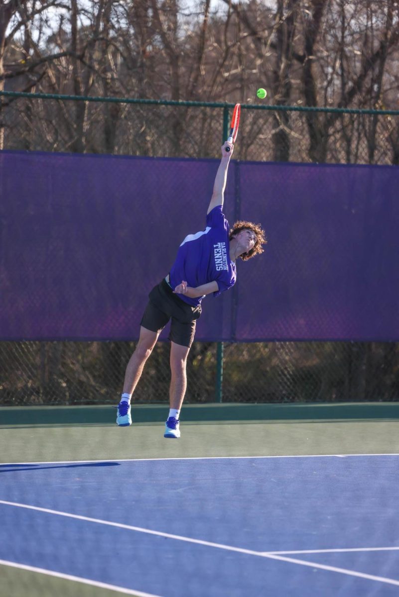 Junior Felipe Selle serves the ball against North Paulding on Feb. 24.