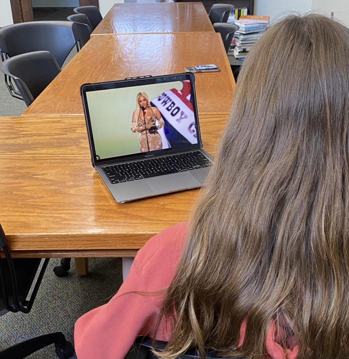 Student watching Beyonce at the Grammys.