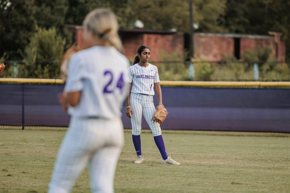 Senior Moanna Maynard looks to her fellow teammates while playing outfield.