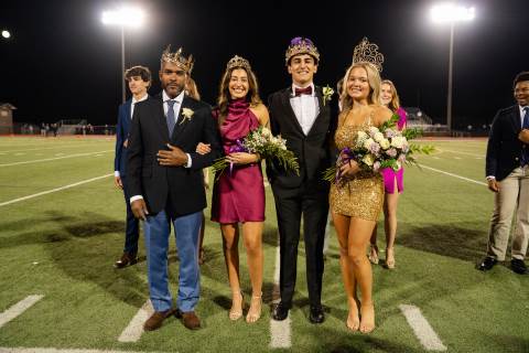 Class of 2025 seniors Atlas Kosedag and Emi Grace Wood, Homecoming King and Queen posing with now senior Zain Khatib and now senior Myles Twyman's father as Homecoming prince and princess.