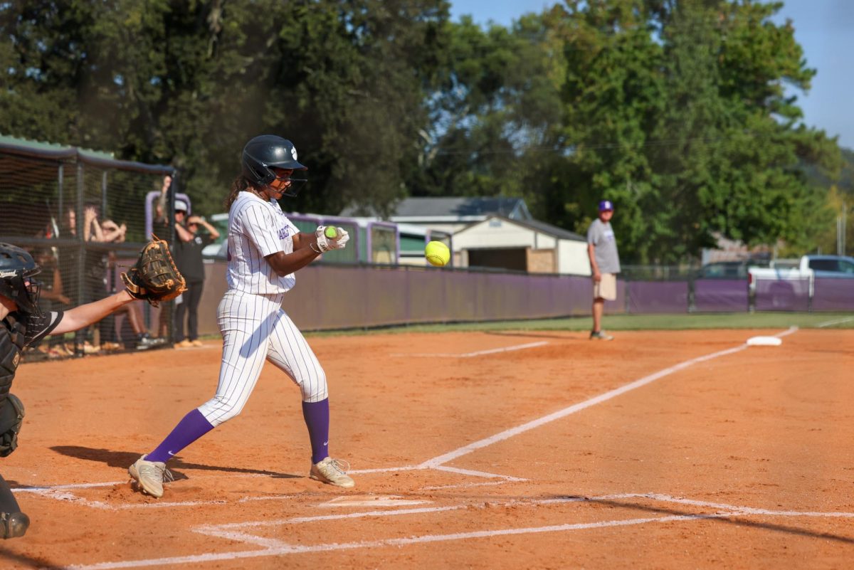 While at bat, Moanna Maynard gets a hit! 