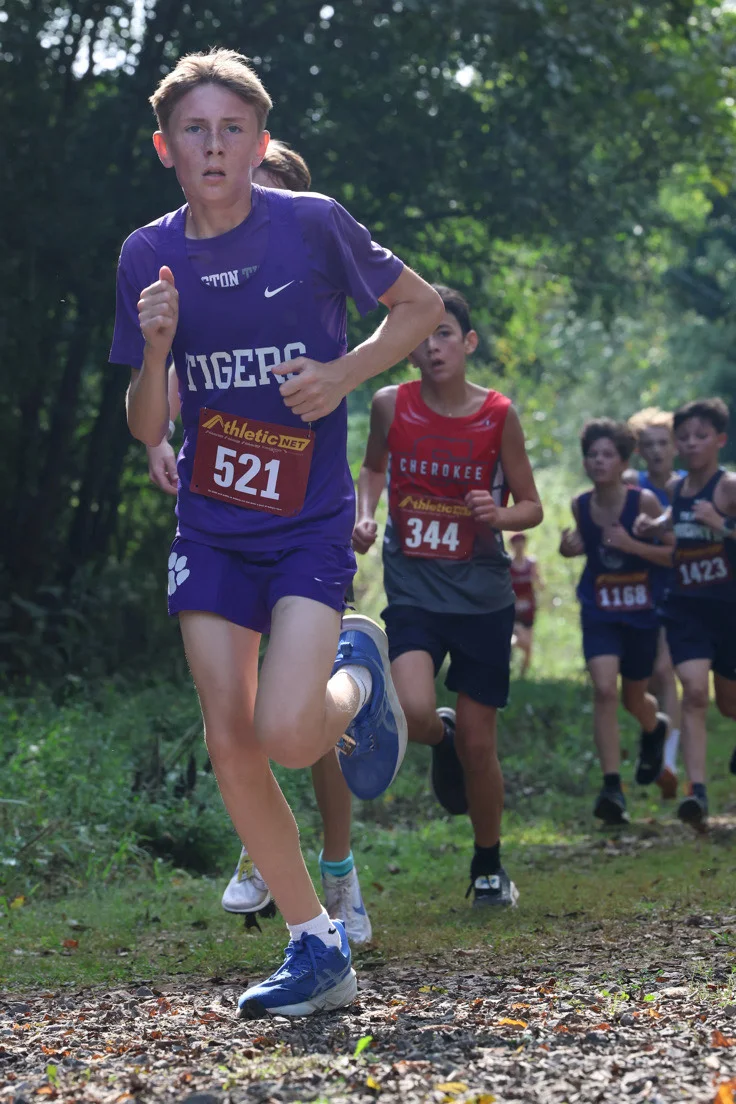 Everett Hopper running middle school boys race.