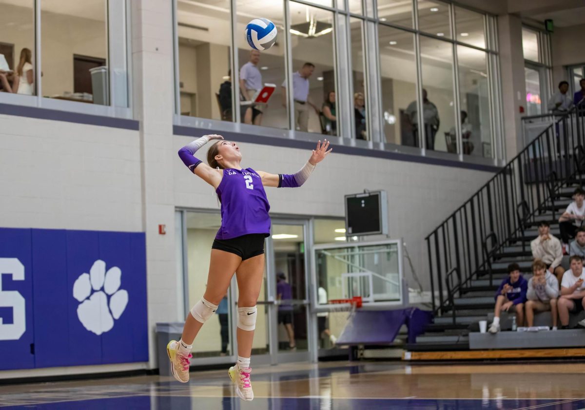 Senior Bryn Merritt serving the ball during the first round of state playoffs against Whitfield Academy.