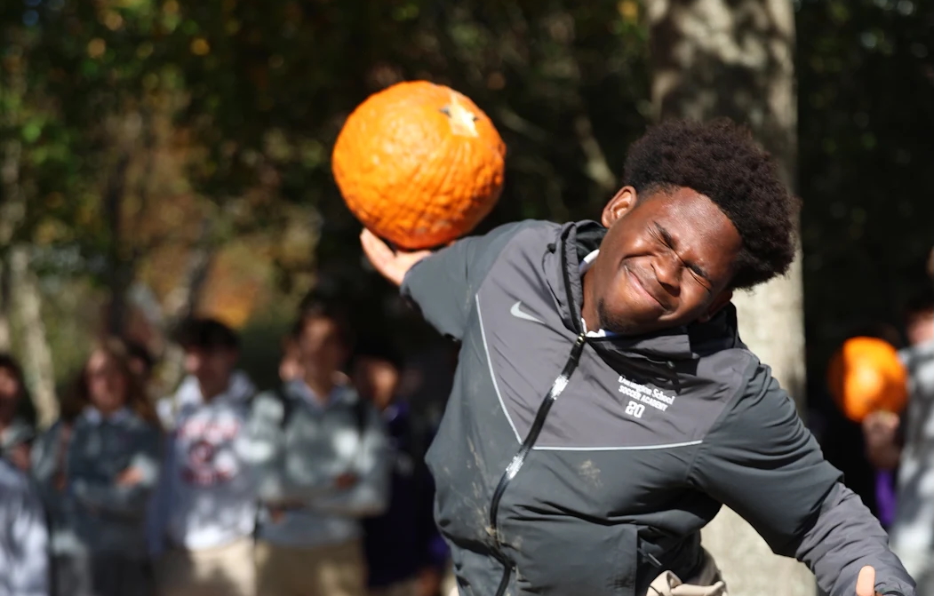 Senior Isaac Adeola launches his pumpkin. 