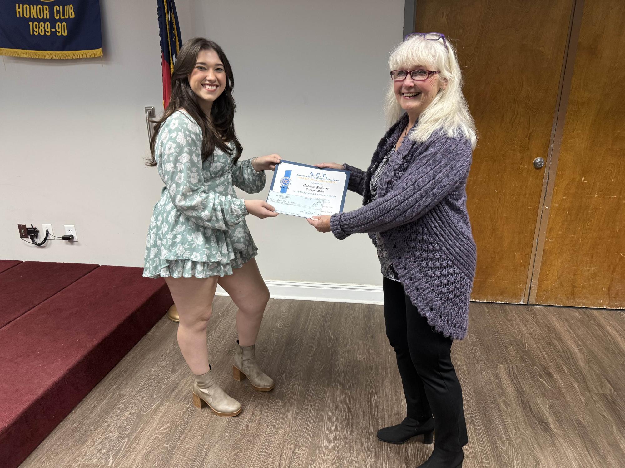 Gabrielle Culberson recieving the A.C.E. Award. 
