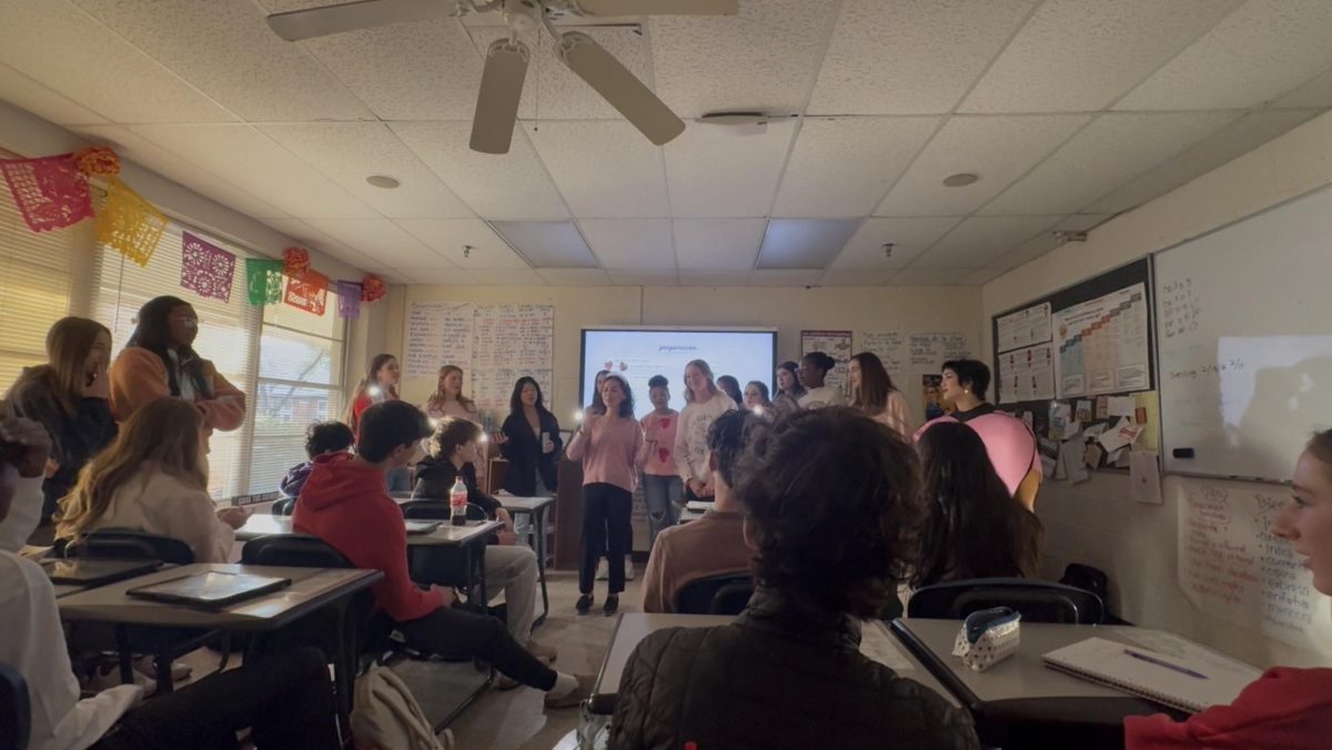 Darlingtones sings to faculty member, Carmen Gonzalez and sophomore Sterling Pollard during 4th period AP Spanish.