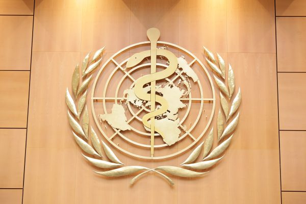 The World Health Organization Emblem. 
United States Mission Geneva, CC BY 2.0 , via Wikimedia Commons, https://commons.wikimedia.org/wiki/File:Logo_of_the_World_Health_Organization.jpg