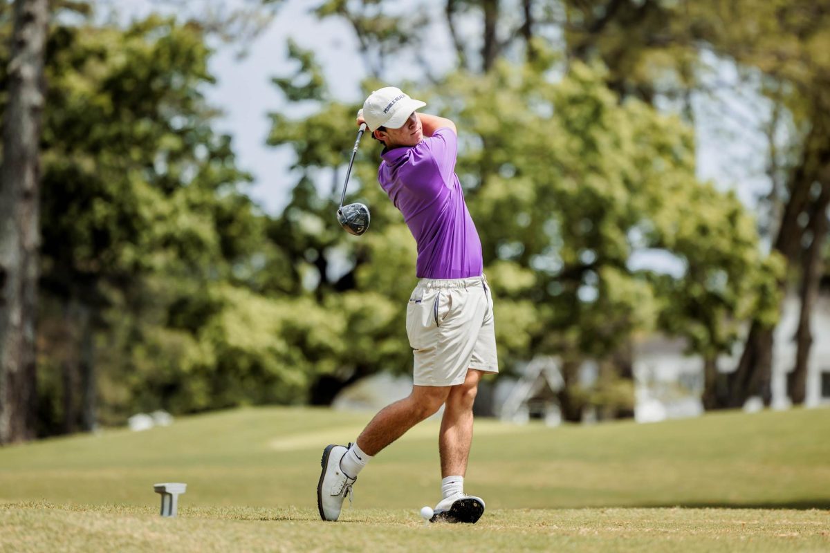 Will Willerson swings a golf club.