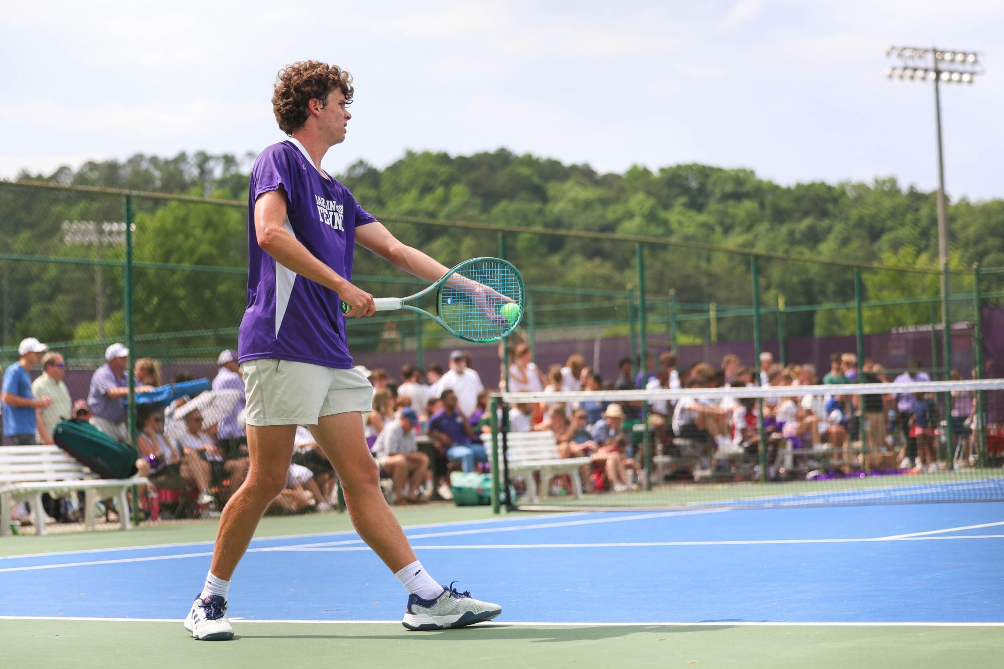 Murray Ellington prepares to serve the tennis ball.