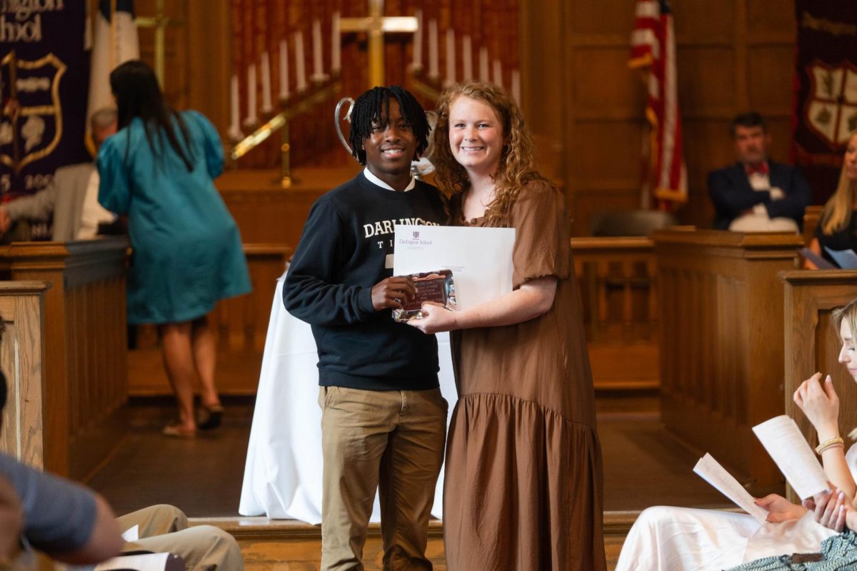 Mrs. Bruce presenting Junior Rayan Noor with the Bo Satterfield Spirit of Life Award during honors day.
