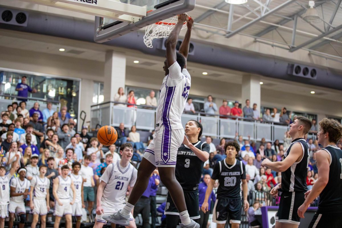  Freshman Joseph Ogunyemi dunks.