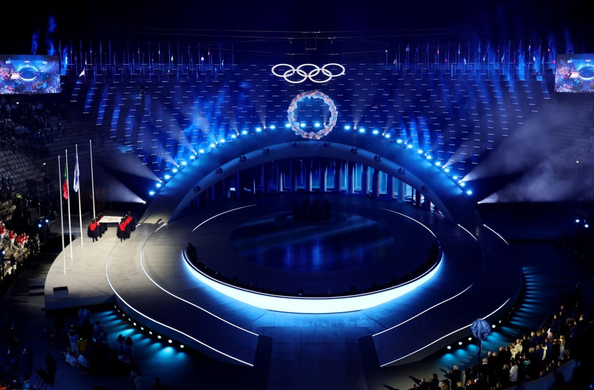 Olympic flag being lowered at the final ceremony in Italy.