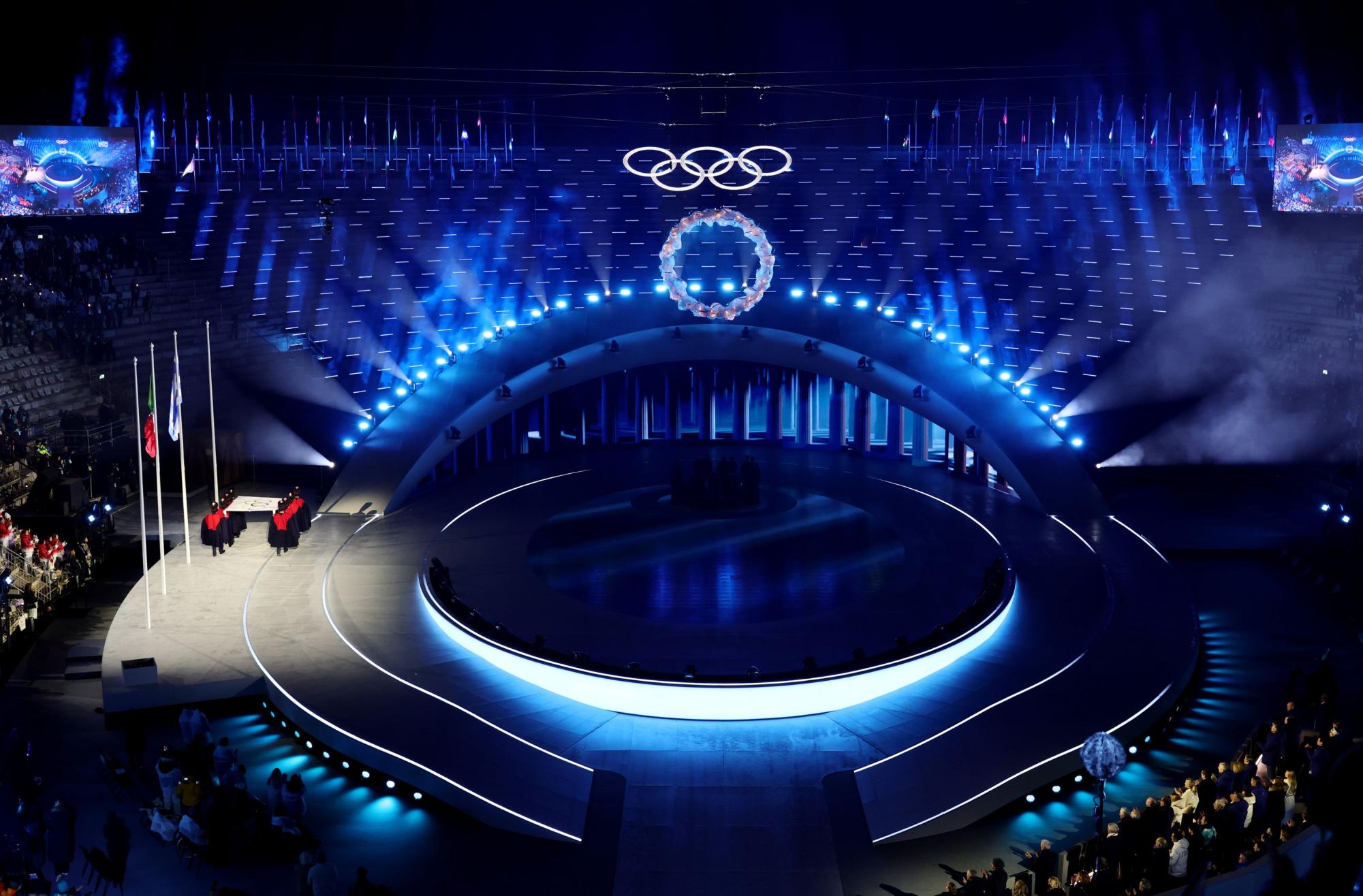 Olympic flag being lowered at the final ceremony in Italy.