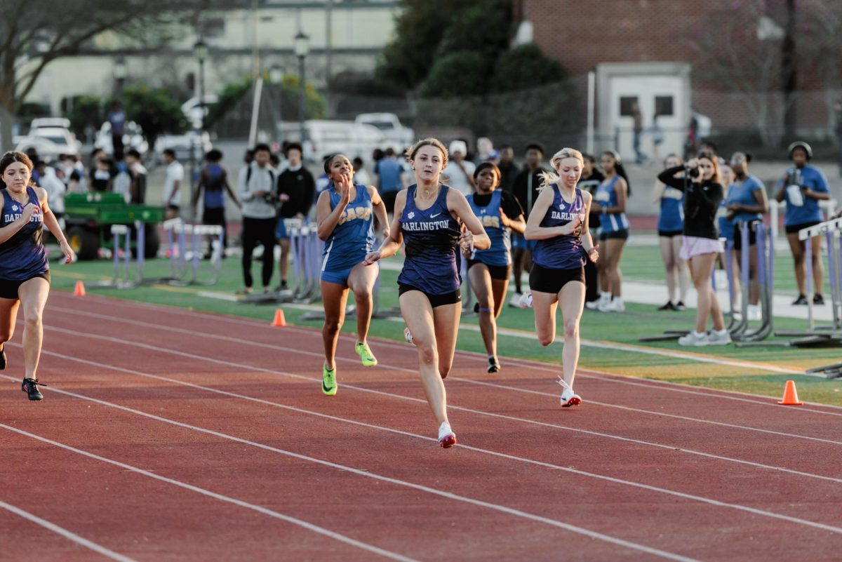 Junior Callie Dempsey takes the lead with a first place finish.