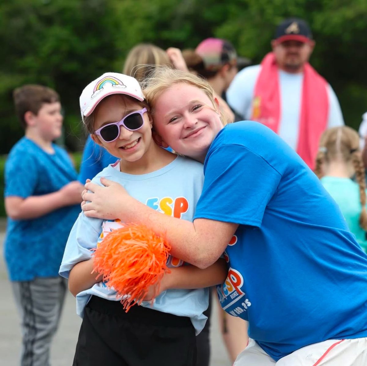 Sophomore Wren booker hugs her buddy at ESP summer camp.