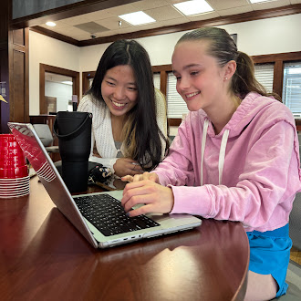 Sophie Strickland and Jane Wei work on the project.